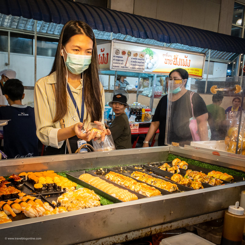 Bangkok, Thailand, girl buying sushi © www.travelblogonline.com